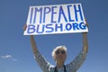 Political rally with a sign reading Impeach Bush in Tucson, AZ