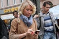 The politician Alyona Popova looks in the smartphone