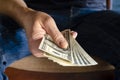 Politician hands taking bribe money under office table, lobbying of interests Royalty Free Stock Photo