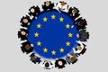 Politicians or authority figures from the EU boss group are discussing strategy around a round table with the EU flag on