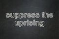 Politics concept: Suppress The Uprising on chalkboard background