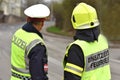 Police officer and firefighter from behind in Upper Austria, Austria, Europe