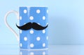 Polka dot coffee mug with mustache