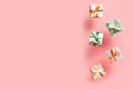 Polka dot pattern gift box with ribbon falling on pink background, levitation Royalty Free Stock Photo