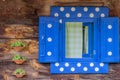 Polka dot window of a wooden house wall 2 Royalty Free Stock Photo