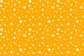 Polka dots on pastel orange background.