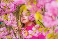 Pollen allergy concept. Kid enjoy cherry blossom sakura. Kid on pink flowers sakura tree background. Child enjoy life