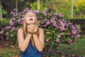 Pollen allergy concept. Young woman is going to sneeze. Flowering trees in background Royalty Free Stock Photo