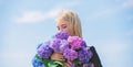 Pollen allergy. Enjoy spring without allergy. Gentle flower for delicate woman. Girl tender blonde hold hydrangea Royalty Free Stock Photo