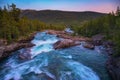 Pollfoss Waterfall on the Framruste Rive at Sunset near Billingdalen, Norway Royalty Free Stock Photo