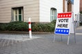 Polling Place Vote Here Sign On Board Royalty Free Stock Photo