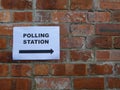 Polling Station sign on a brick wall