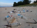 The polluted beach full with garbage and plastics