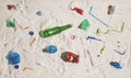 Polluted beach with plastic and glass waste Royalty Free Stock Photo