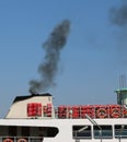 polluted black smog of a boat