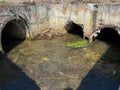 Polluted, dirty wastewater flowing in the old, crumbling concrete pit Royalty Free Stock Photo