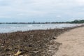 Polluted ocean. Garbage on the beach makes the beach unattractive.