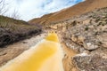 Polluted river with toxic yellow water Royalty Free Stock Photo