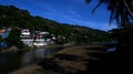 Polluted and stinking huge river teeming with shanty dwellers in a suburban community