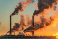 Polluting Factory at Dawn. Atmospheric air pollution from industrial smoke and dioxide Royalty Free Stock Photo