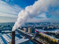 Pollution in a large city. White smoke coming from a huge industrial chimney