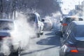 Pollution from the exhaust of cars in the city in the winter. Smoke