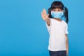 Coronavirus Covid-19.Stay at home Stay safe concept.Little girl wearing mask for protect.show stop hands gesture Royalty Free Stock Photo