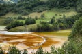 Pollution of a lake with contaminated water from a gold mine. Royalty Free Stock Photo