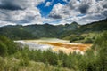 Pollution of a lake with contaminated water from a gold mine. Royalty Free Stock Photo