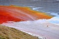 Pollution of a lake with contaminated water from a gold mine. Royalty Free Stock Photo