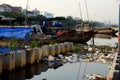 Pollution river from litter at Ho Chi Minh city, Viet Nam, trash from plastic bag, bottle, packaging in water