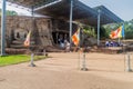 POLONNARUWA, SRI LANKA - JULY 22, 2016: Tourists visit Buddha statues at Gal Vihara rock temple in the ancient city Royalty Free Stock Photo