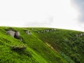 Polonyna Runa, Transcarpathian region. Mountains in spring and summer. Green hills and blue sky. Rocks and ruins in nature. Royalty Free Stock Photo