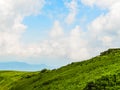 Polonyna Runa, Transcarpathian region. Mountains in spring and summer. Green hills and blue sky. Rocks and ruins in nature. Royalty Free Stock Photo