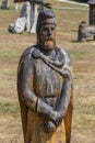 Wooden sculptures with Dacian themes in the Polovragi sculpture camp, Gorj, Romania. Royalty Free Stock Photo