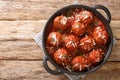 Polpette meatballs with parmesan stewed in a rich tomato sauce close-up in a frying pan. Horizontal top view Royalty Free Stock Photo