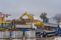 Poland Ostrowiec Swietokrzyski November 17, 2023 at 12:20. Komatsu excavator on a road construction site in the rain.