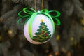 Poltava, Ukraine - 30 October, 2023: A New Year\'s ball is decorated with a cross-stitched Christmas tree