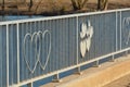 Poltava, Ukraine - April 4, 2019: Iron fence on the bridge with decorations in the form of hearts Royalty Free Stock Photo