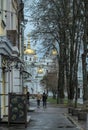 Rainy spring morning in the old town. People walking through the historic center in Poltava, Ukraine Royalty Free Stock Photo