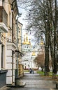 Rainy spring morning in the old town. People walking through the historic center in Poltava, Ukraine Royalty Free Stock Photo