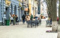 Rainy spring morning in the old town. People walking through the historic center in Poltava, Ukraine Royalty Free Stock Photo