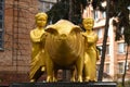 POLTAVA, UKRAINE - MARCH 2, 2023: Bronze sculpture of a pig and figures of two children on a pedestal