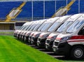 Ambulances stand at the stadium during the day Royalty Free Stock Photo
