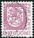 Vintage stamp printed in Finland 1978 show coat of arms with a lion