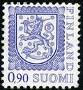 Vintage stamp printed in Finland 1977 show coat of arms with a lion