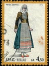Vintage stamp printed in Greece 1972 shows woman in folk costume