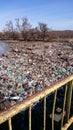 Polution with plastic waste on a river Royalty Free Stock Photo
