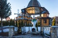 Old rustic wooden orthodox christian church and the statue of the Virgin Mary Royalty Free Stock Photo