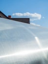 Polycarbonate sheeting as a part of modern greenhouse construction, blue sky